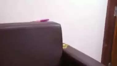 Indian MILF covers her saggy tits with pink bra in quick porn clip