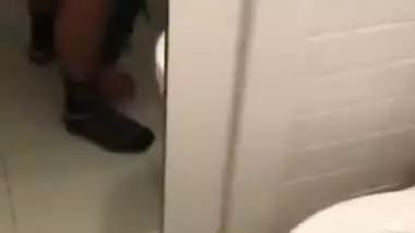 Indian girl fucks in a public bathroom in NRI porn